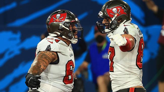 Rob Gronkowski #87 of the Tampa Bay Buccaneers, right, reacts after scoring a 17-yard touchdown in the second quarter against. Picture: Mike Ehrmann/Getty Images