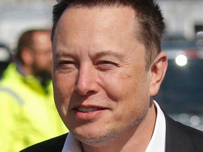 (FILES) In this file photo taken on September 03, 2020 Tesla CEO Elon Musk gestures as he arrives to visit the construction site of the future US electric car giant Tesla, in Gruenheide near Berlin. - Carmaker Tesla's 