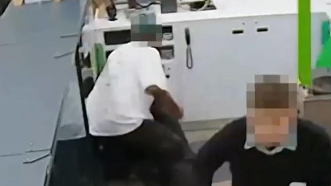 Traumatising: Another clip shows a customer come behind the counter and bash a worker into a corner. Picture: Supplied.