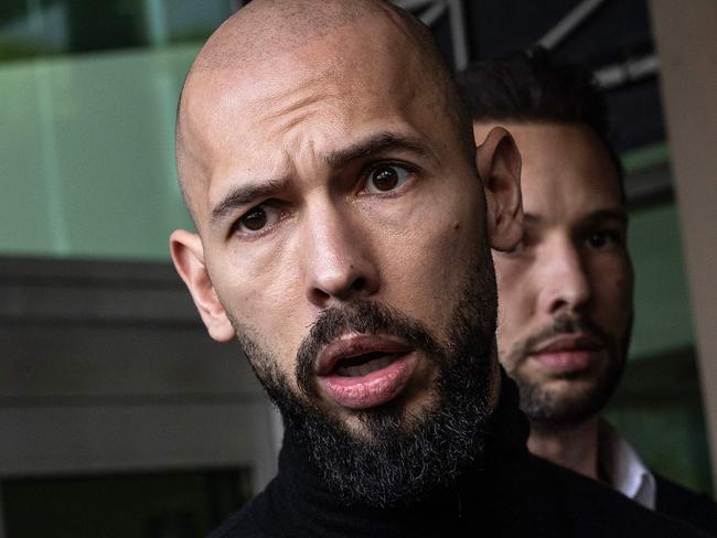 FORT LAUDERDALE, FLORIDA - FEBRUARY 27: Andrew Tate (L) and Tristan Tate (R) arrive in the United States after a travel ban on them was lifted, at the Fort Lauderdale-Hollywood International Airport on February 27, 2025 in Fort Lauderdale, Florida. The influencer brothers were arrested in late 2022 and charged with human trafficking, alleging that they participated in a criminal ring that lured women to Romania, where they were sexually exploited. Andrew Tate was also accused of rape.   Alon Skuy/Getty Images/AFP (Photo by Alon Skuy / GETTY IMAGES NORTH AMERICA / Getty Images via AFP)