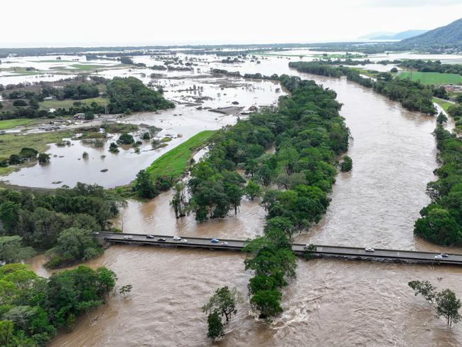 CAIRNS FLOOD BEFORE AND AFTER - The Barron River in Cairns, Far North Queensland, reached a record flood peak, with roads closed and homes flooded in the catchment area on Sunday, December 17. Flood waters lap at the Kamerunga bridge on the Western Road, and despite the bridge remaining open, road access was cut to the northern beaches of Cairns. The record flooding has been caused by ex Tropical Cyclone Jasper, which made landfall on December 13. Picture: Brendan Radke