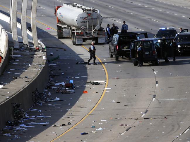 Police clear the area where a tanker truck rushed to a stop among protesters on an interstate in Minneapolis. Picture: AP