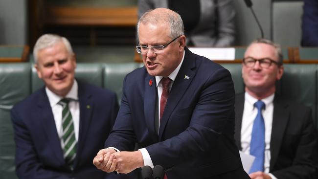 Scott Morrison takes his imaginary bat to the Opposition yesterday. Picture: AAP