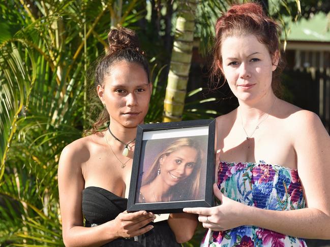 (R) Nikki Duncan (sister-in-law) and Minnie Clubb (younger sister) with photos of Monique Clubb who went missing two years ago. Photo: Alistair Brightman / Fraser Coast Chronicle