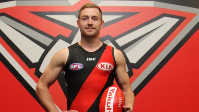 Essendon recruit Devon Smith shows off his new colours.