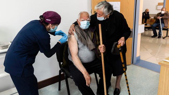 A healthcare worker administers a dose of the coronavirus vaccine to an elderly man in the Cypriot coastal city of Limassol. Picture: AFP