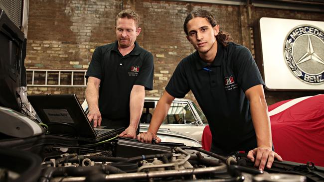 CMR Automotive owner Cameron Virtue, left, and his first-year apprentice Nassim Guellati at his Sydney workshop. Picture: Adam Yip