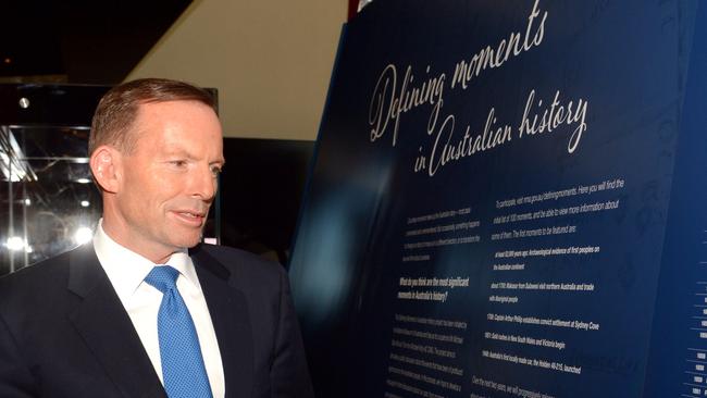 Tony Abbott looks through exhibits after he launched Defining Moments in Australian History project at the National Museum in Canberra last week.