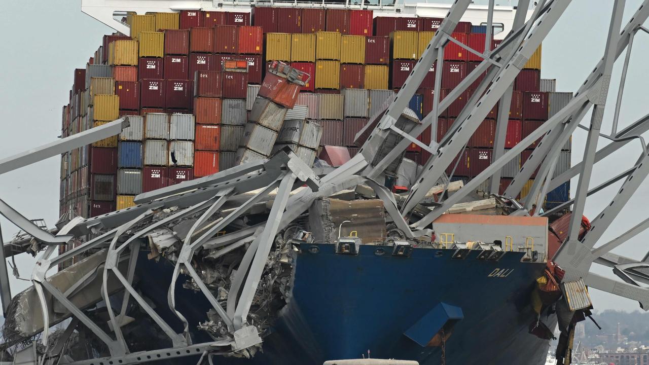 The steel frame of the Francis Scott Key Bridge sits on top of the container ship Dali after the bridge collapsed. Picture: AFP