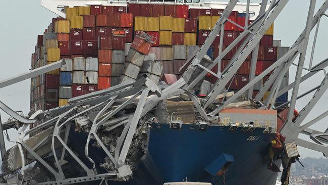 Horrifying footage shows the bridge crumbling after the 300m Dali, a Singapore-flagged vessel heading to Sri Lanka, crashed into the central part of the structure. Picture: AFP
