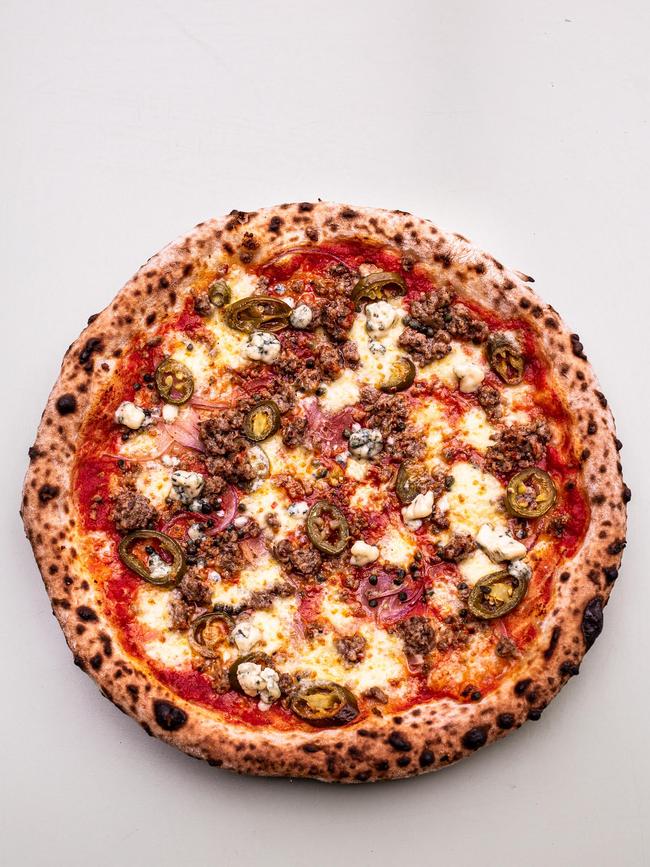 Local Pizza’s Wild Child pizza is full of porky goodness and features Scottsdale pork sausage, fennel, capers, gorgonzola and jalapenos. Picture: Dearna Bond