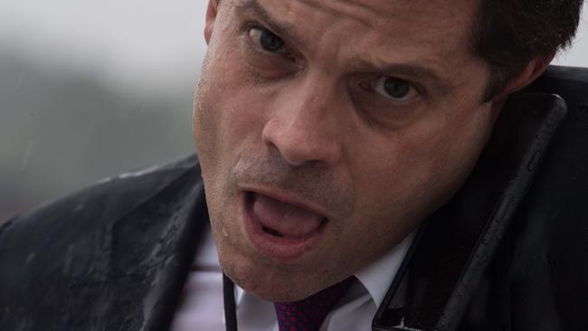 White House Comunications Director Anthony Scaramucci speaks on the phone as he boards Air Force One. / AFP PHOTO / NICHOLAS KAMM