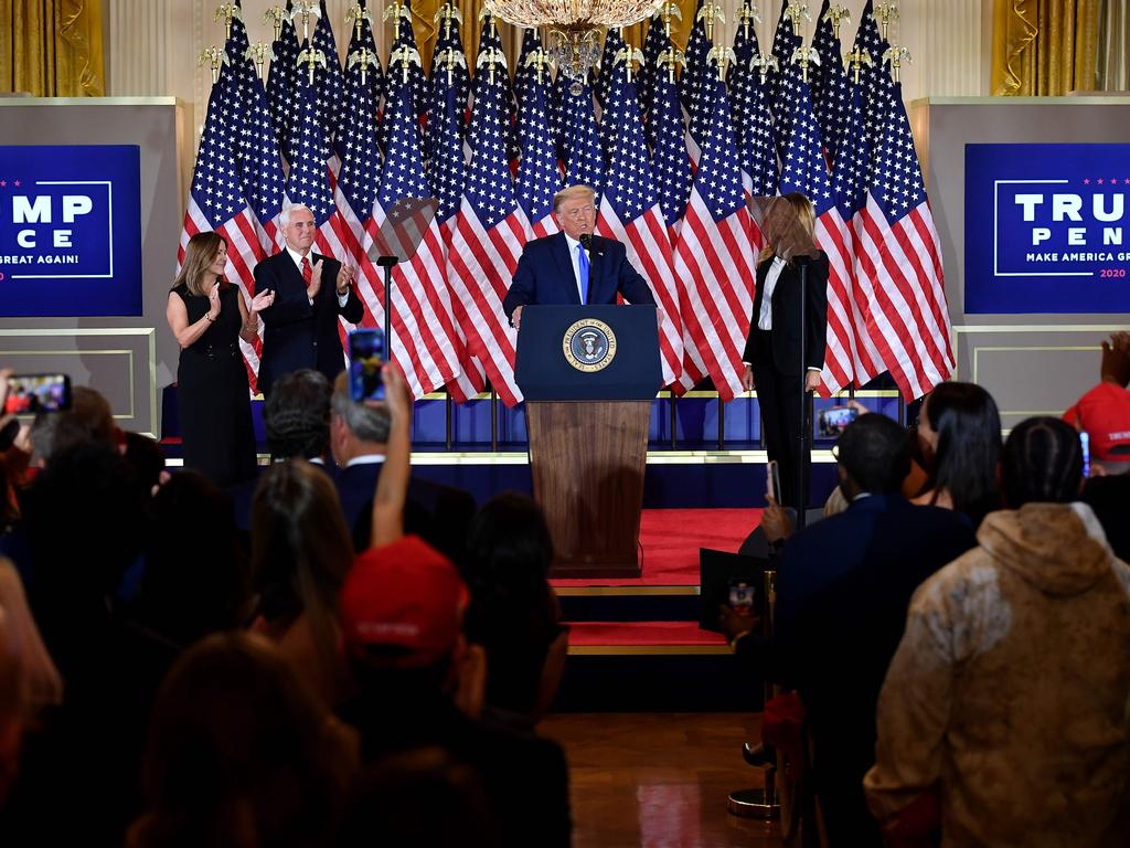 Mr Trump at the podium on election night alongside First Lady Melania Trump, Vice President Mike Pence and Second Lady Karen Pence. Picture: Mandel Ngan / AFP