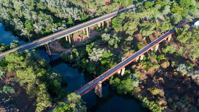 The Eugene Betti Bridge is the only heavy vehicle access route over Katherine River. The old railway bridge is today used as a viewing platform. Picture: Che Chorley