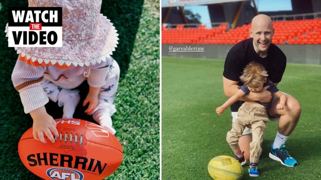 Little Levi Ablett with dad Gary at Metricon live now