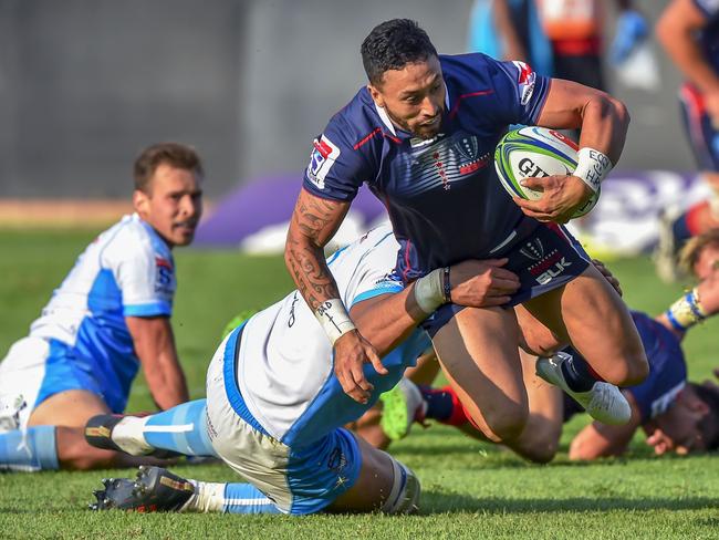 Rebels' Michael Ruru (L) dives and scores a try as Bulls' Lood de Jager (2nd L) tackles him  during the Super Rugby rugby union match between South Africa's Bulls and Australia's Rebels at the Loftus Versfeld Stadium in Pretoria on April 21, 2018. / AFP PHOTO / Christiaan Kotze