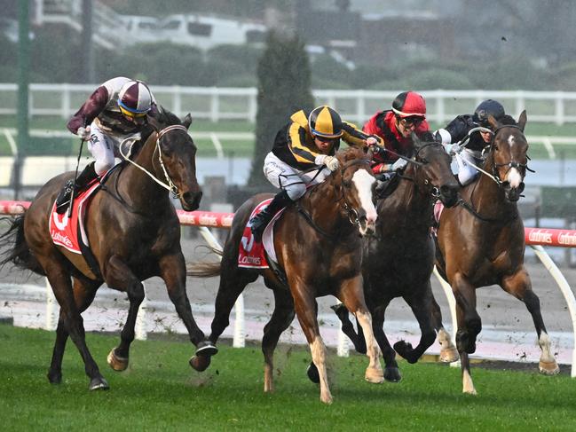 MELBOURNE, AUSTRALIA - AUGUST 12: Michael Dee riding Sweet Ride races down the middle to defeat Acromantula (r) in Race 9, the Steveos Scamper Handicap, during Melbourne Racing at Moonee Valley Racecourse on August 12, 2023 in Melbourne, Australia. (Photo by Vince Caligiuri/Getty Images)