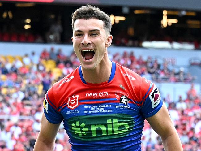 BRISBANE, AUSTRALIA - APRIL 28: David Armstrong of the Knights celebrates after scoring a try during the round eight NRL match between Dolphins and Newcastle Knights at Suncorp Stadium, on April 28, 2024, in Brisbane, Australia. (Photo by Bradley Kanaris/Getty Images)