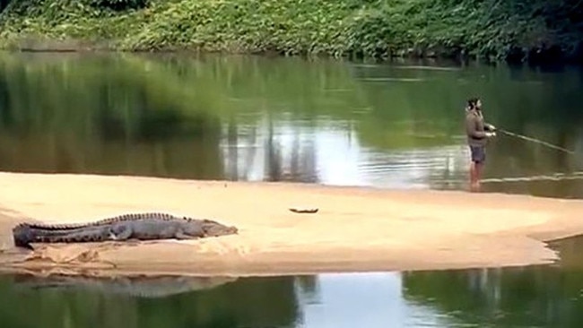 A fisho in August last year was caught on camera flicking lures just metres from a huge croc on the Russell River. Picture: Supplied