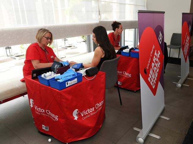 Members of the Victor Chang Mobile Heart Health check team measure heart health indicators. Picture: Belinda Rolland