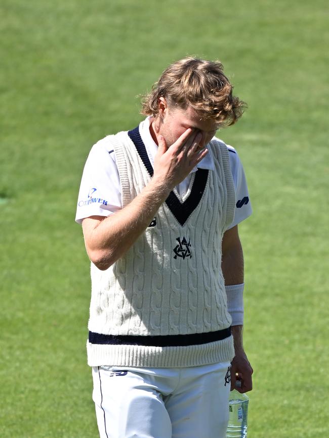 Will Pucovski leaves the field after being struck during the Sheffield Shield match on Sunday. Picture: Steve Bell/Getty Images.