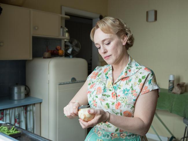 Lisa’s mother (Susie Porter) prepares dinner in a kitchen typical of 1950s Sydney. Separate rooms are a far cry from the open-plan homes we prefer today.