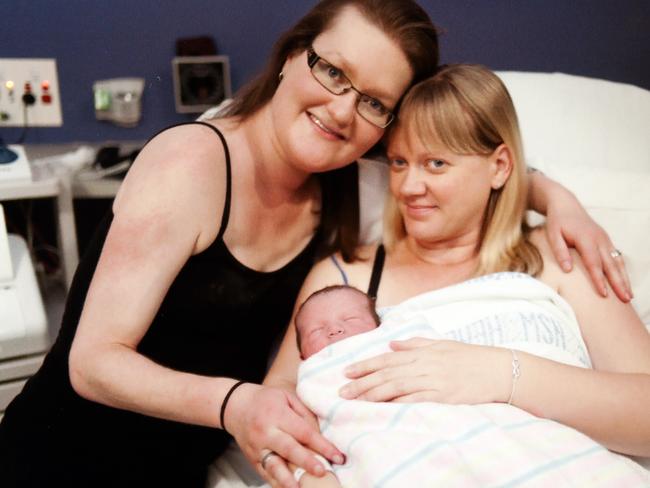 Miranda Hill (left) with her newborn son Harry and surrogate mother Megan Hill after the birth.