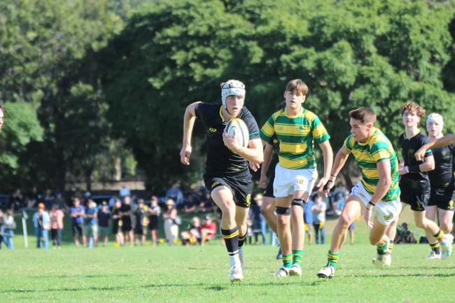 Finn Mackay runs the ball for St Laurence’s College last season.
