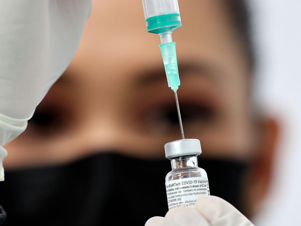 A health worker prepares an injection of the Pfizer-BioNTech vaccine. Picture: Karim Sahib/AFP