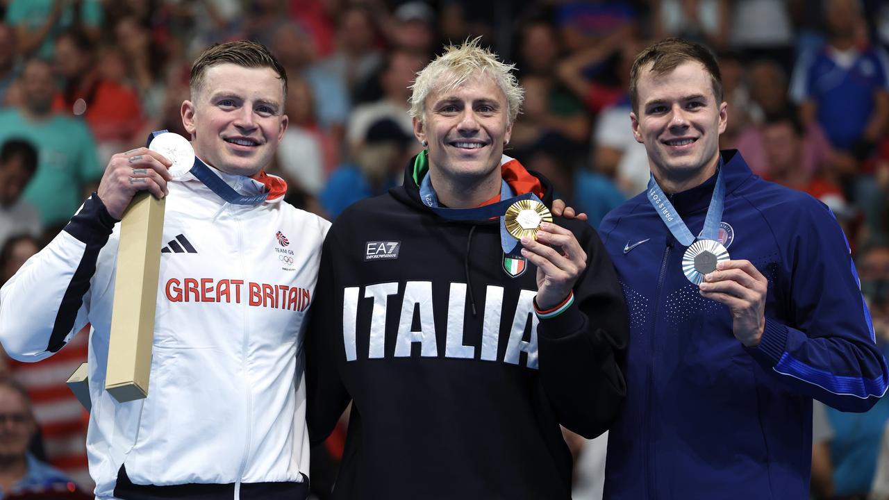 Adam Peaty (left) with his box after coming second in the 100m breaststroke. (Photo by Quinn Rooney/Getty Images)