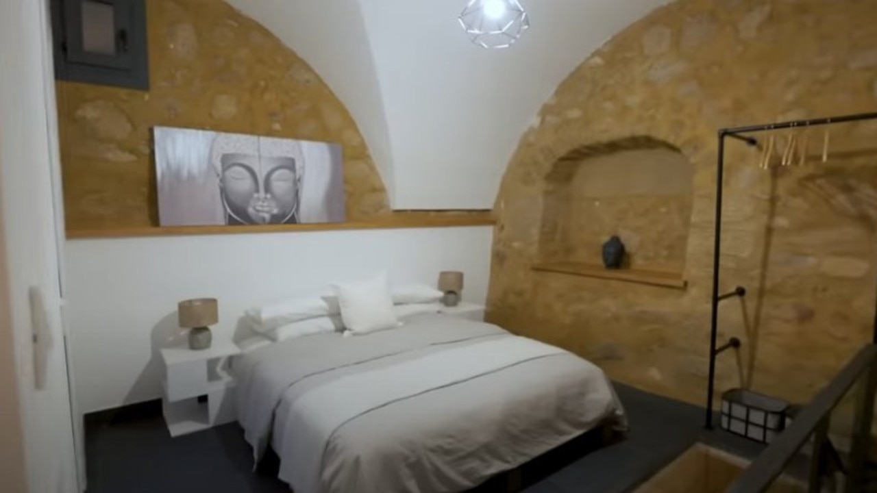 This bedroom was formerly the main room of one of the houses. Picture: CNBC Make It/YouTube