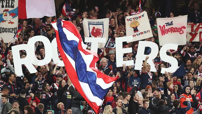 Roosters fans celebrate victory during the NRL qualifying final match between the Roosters and South Sydney Rabbitohs.