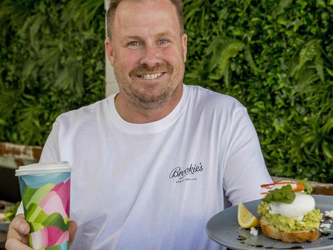 Scott Imlach's new Nobby's brunch spot The Backyard Cafe. Scott holding a smashed Avo dish.  Picture: Jerad Williams