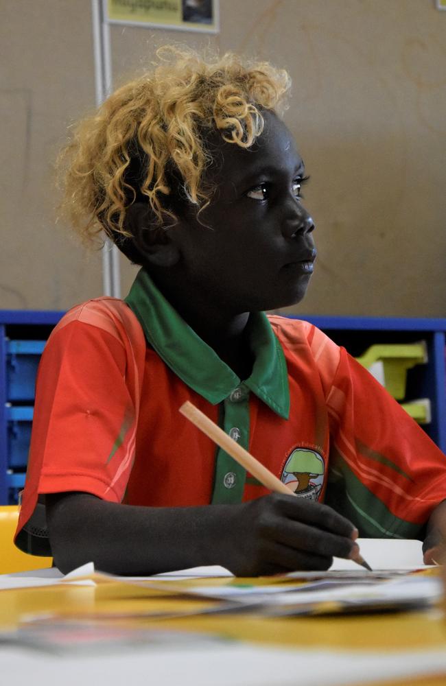 A Milingimbi Community Education Centre student studies writing in class. Picture: Sierra Haigh