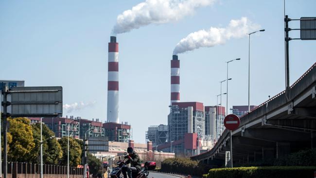 A 2017 picture of the Shanghai Waigaoqiao Power Generator Company coal power plant in China. (Photo by JOHANNES EISELE / AFP)