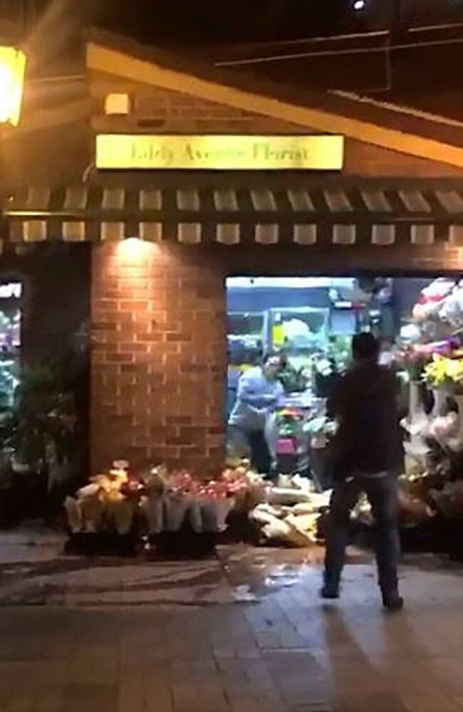 A police officer in a stand-off with a man at Central Station. Seconds later the man ran at police armed with scissors and was shot dead.