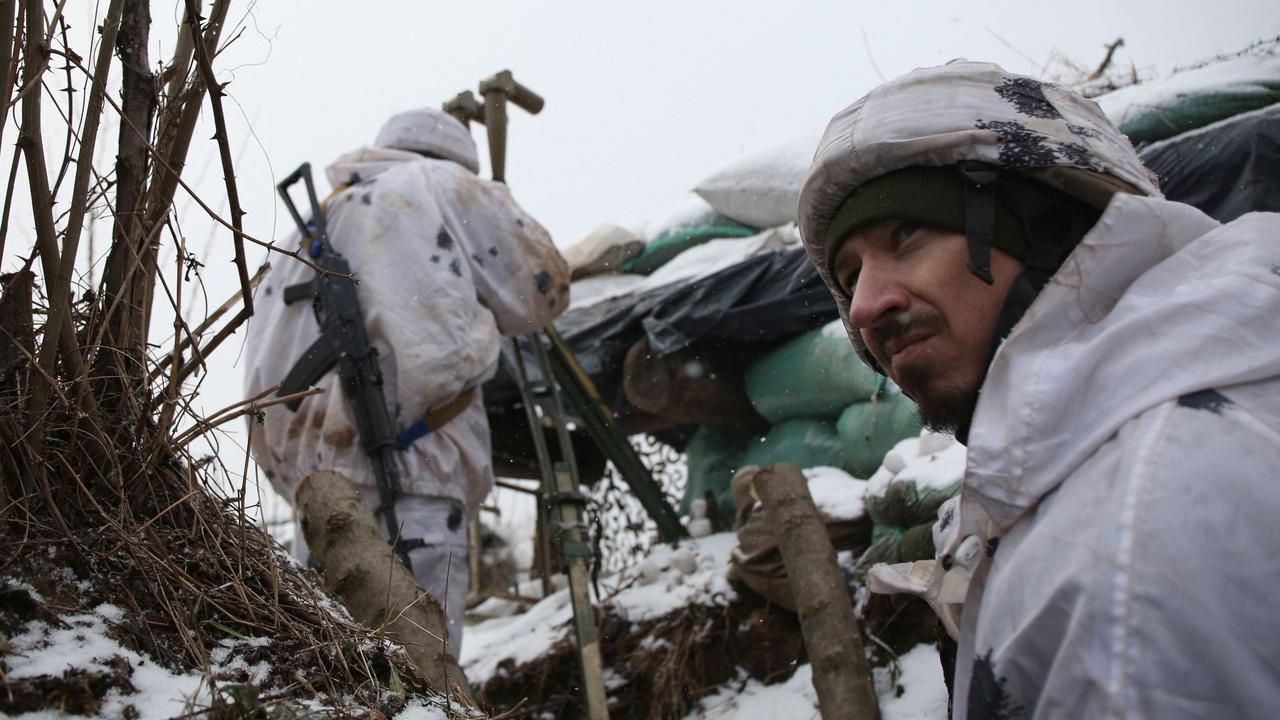 A Ukrainian Military Forces serviceman in a trench on the frontline with Russia-backed separatists near Verkhnetoretske village, in the Donetsk region, on January 18, 2022. Picture: Anatolii Stepanov/AFP