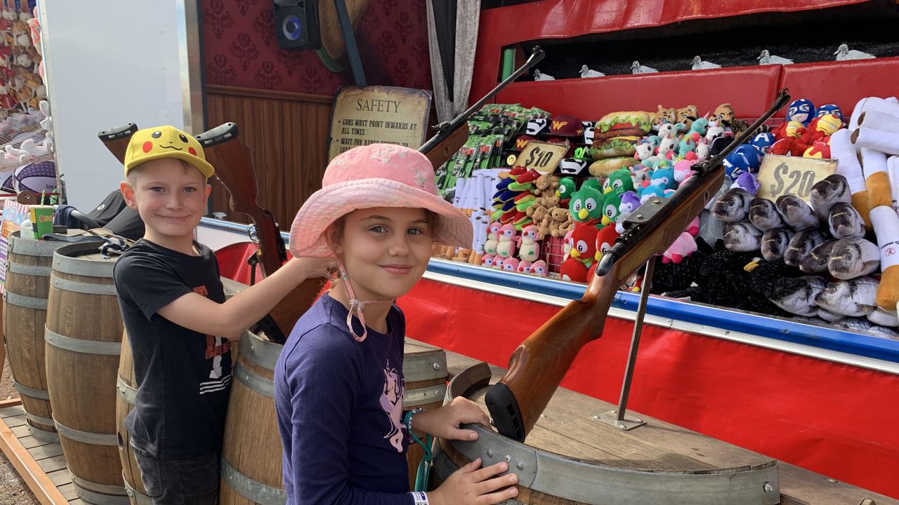 Finn Ammenhauser and Veronica van der Merwe had a blast in the side show alley at the 2021 Fraser Coast Show. Photo: Stuart Fast