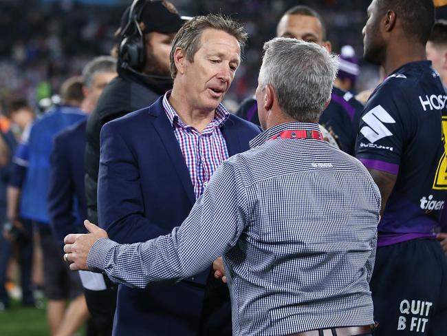 Craig Bellamy, left, talks to then Cowboys head coach Paul Green at the conclusion of the 2017 NRL Grand Final. Picture: Mark Metcalfe/Getty Images