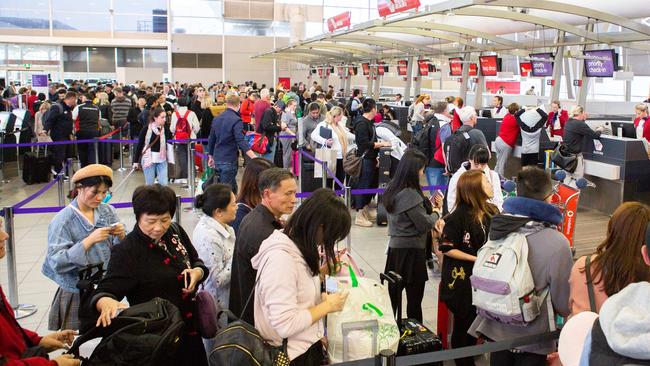 Long queues of frustrated passengers at Sydney Airport yesterday. Picture: Luke Drew