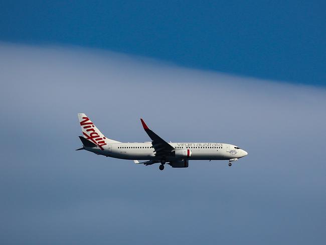 SYDNEY, AUSTRALIA - NewsWire Photos, SEPTEMBER, 12 2021: Virgin Airlines is seen flying over Bronte Beach in Sydney: NCA NewsWire / Gaye Gerard