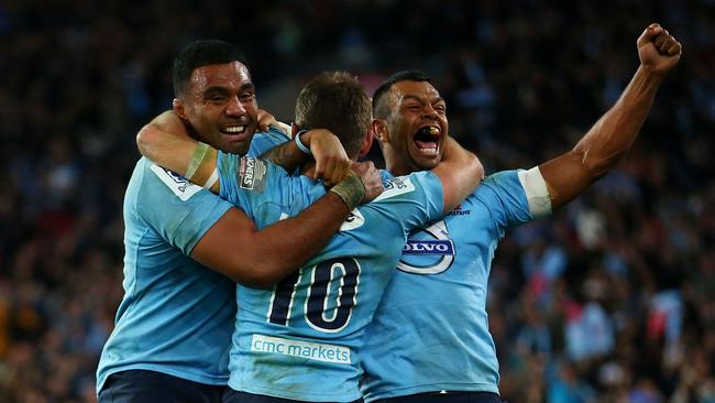 Waratahs stars Wycliff Palu, Bernard Foley and Kurtley Beale celebrate winning the Super Rugby final.