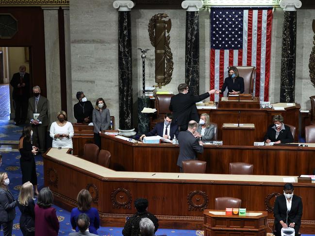 Nancy Pelosi pictured presiding over the vote to impeach Donald Trump in the House Chamber of the US Capitol. Picture: AFP