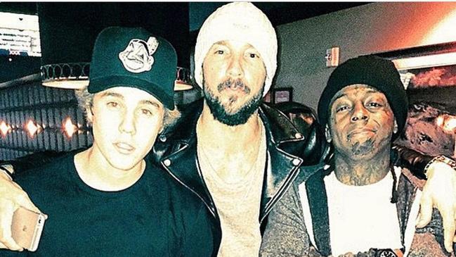 Lentz with Justin Bieber and rapper Lil Wayne.