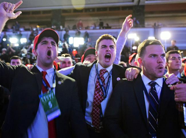 Supporters of Republican presidential nominee Donald Trump reacts to early results during election night at the New York Hilton Midtown in New York on November 8, 2016. / AFP PHOTO / Mandel NGAN