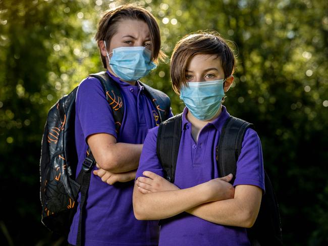 Felix and Oliver wearing masks to school. Picture: Jake Nowakowski