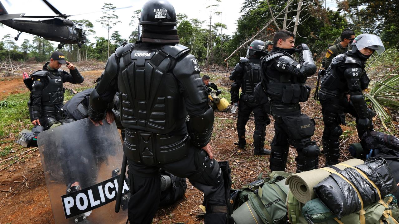 Police National Narcotics personnel in Tumaco (south west Colombia ) during a cocaine plantation operation. Picture Gary Ramage