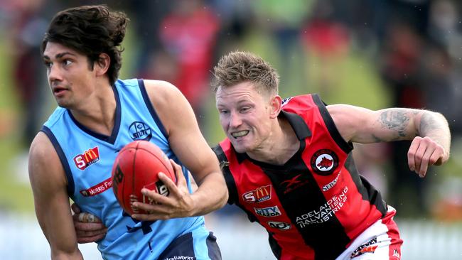 Shane McAdam in tries to evade West Adelaide's Errin Wasley-Black. McAdam was a revelation for Sturt this season. Picture: AAP Image/Dean Martin