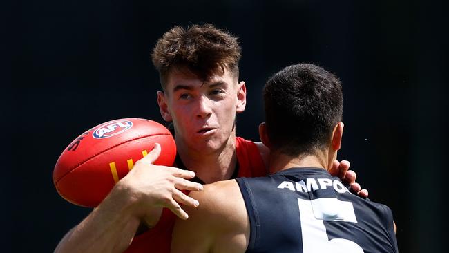 MELBOURNE, AUSTRALIA - FEBRUARY 22: Hugh Boxshall of the Saints is tackled by Adam Cerra of the Blues during the 2025 AFL match simulation between the Carlton Blues and St Kilda Saints at Ikon Park on February 22, 2025 in Melbourne, Australia. (Photo by Michael Willson/AFL Photos via Getty Images)