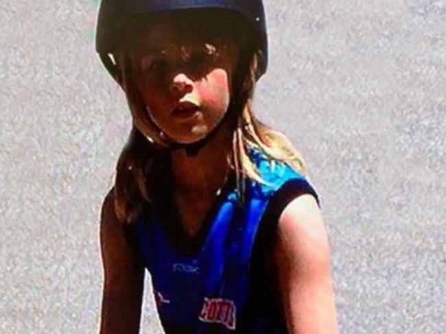 Port Adelaide AFL Women's forward Ashleigh Saint (nee Woodland) pictured in her Port Adelaide jumper as a child.